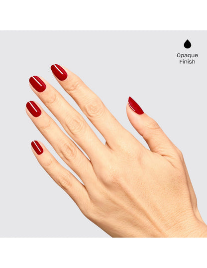 A hand with neatly manicured nails painted in a deep opaque red polish, shown against a light gray background with a small black droplet icon and the text 'Opaque Finish' in the top right.